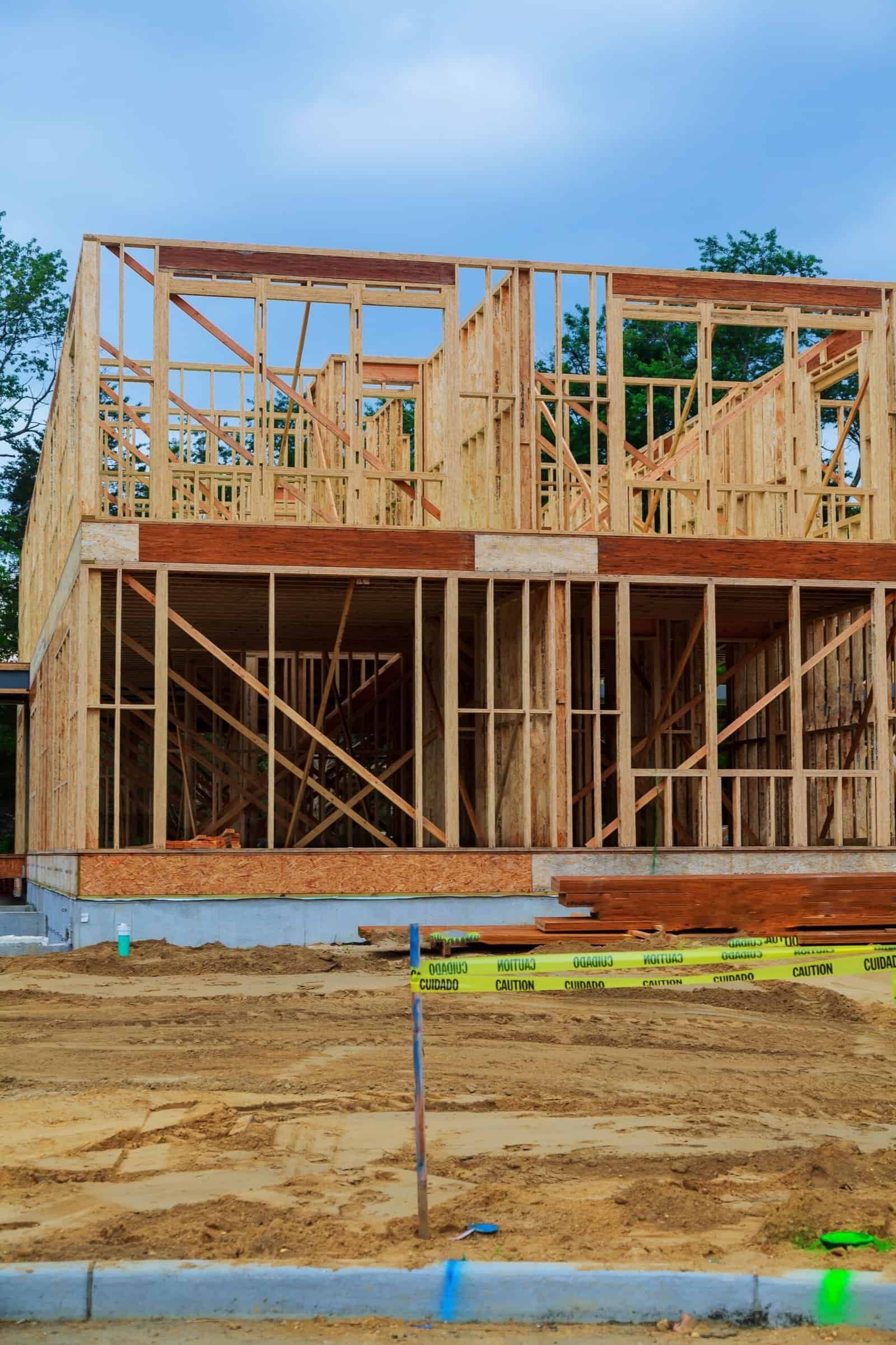 Construction site of a new residential house with wooden framing, demonstrating Merced Home Development Inc.